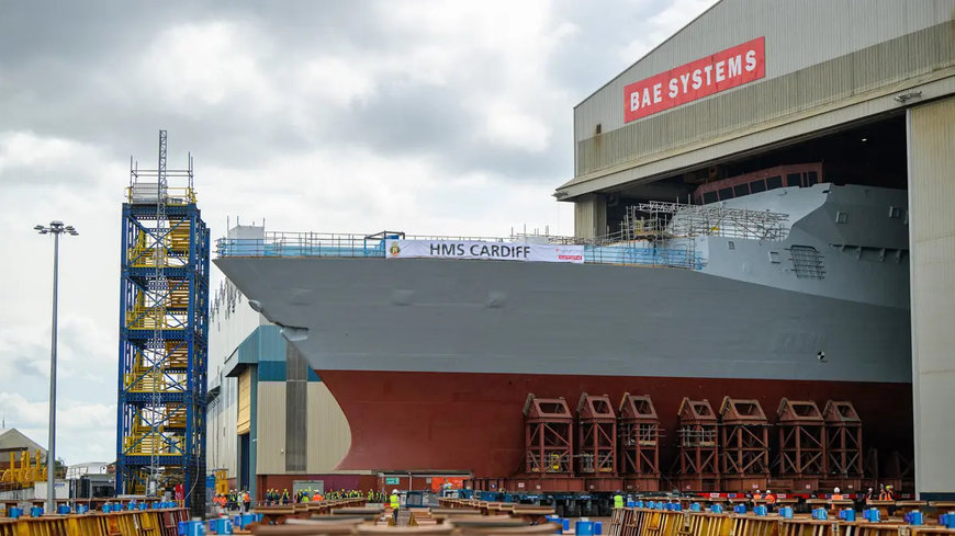TYPE 26 FRIGATE HMS CARDIFF EMERGES ON GOVAN SKYLINE